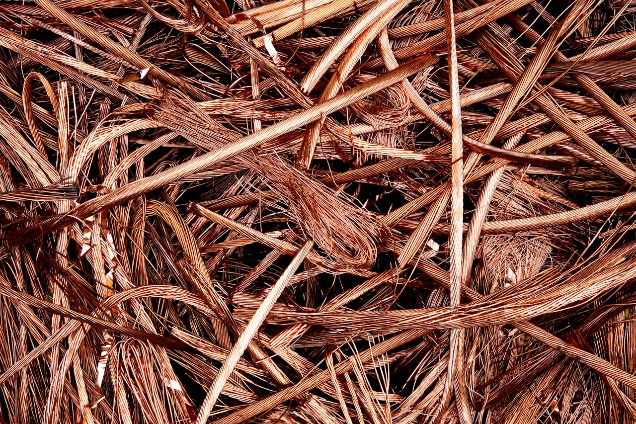 Close-up view of intertwined copper wires ready for recycling, emphasizing industrial reuse.